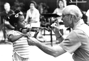 John D Kendall teaching a young violin student